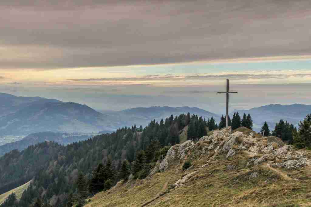 cross on a hill, contrasting Jesus' blood with that spilled between Adam and Eve's sons