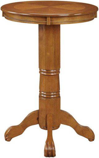 Una mesa pedestal de madera con tablero circular y base ornamentada, que recuerda a los púlpitos modernos de las iglesias, desprende elegancia y un diseño atemporal.