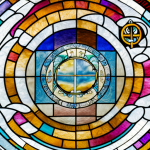 10 Best Hymns for Trinity Sunday A church with a stained glass window depicting a trinity of symbols