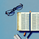A bible with a light shining on it