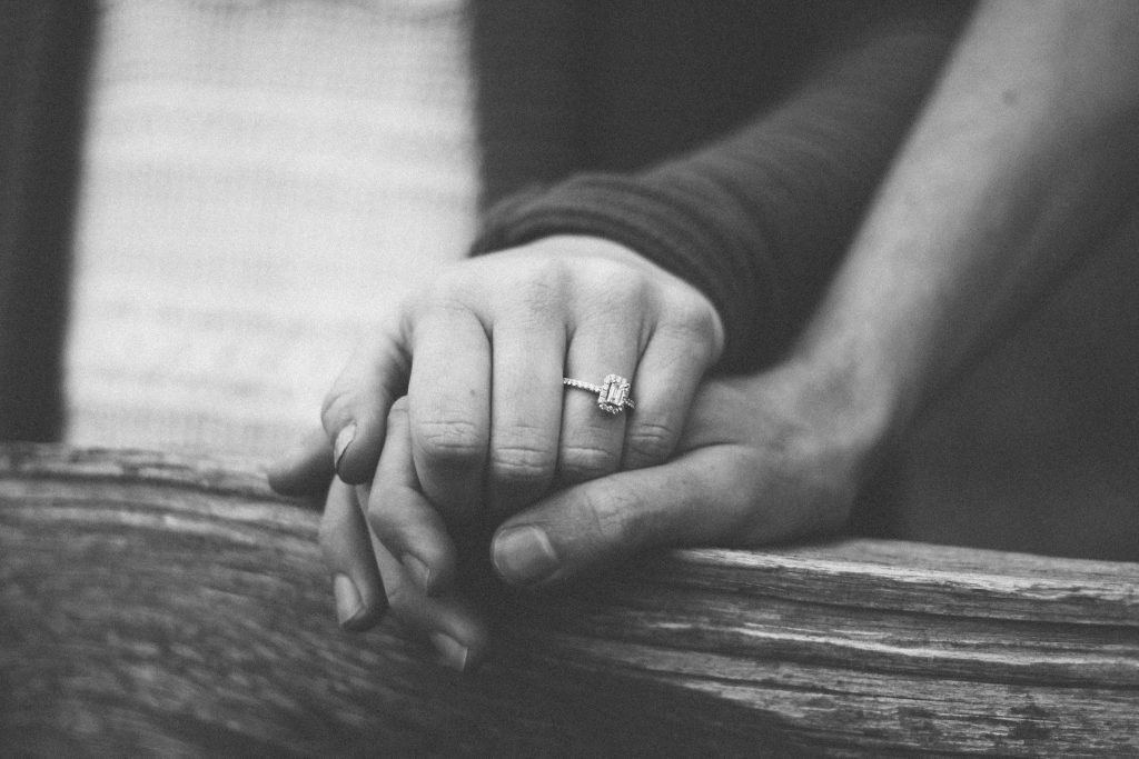 A close-up of two hands, like a married couple with unconditional love