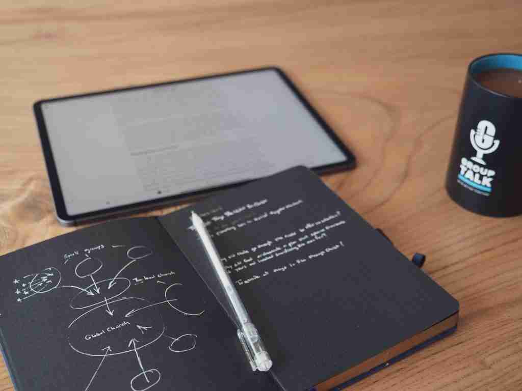 notebook with church growth strategy and discipleship
