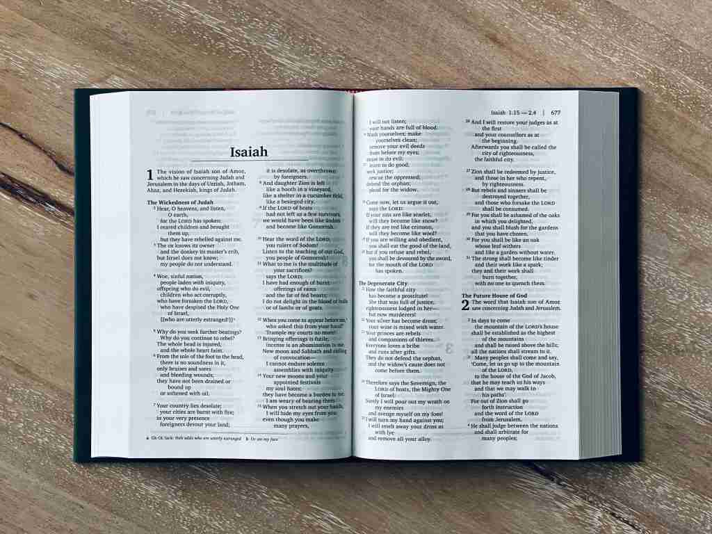 Bible laying open at the book of Isaiah 1:18 meaning