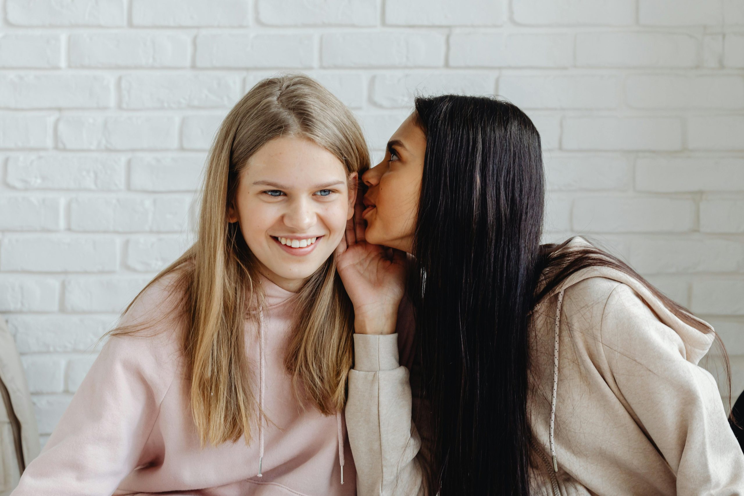 Two young ladies gossiping
