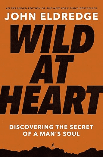 Book cover of "Wild at Heart" by John Eldredge, orange with a tiny silhouette of a man running at the bottom, making it an inviting choice for those seeking the best Bible studies for men.