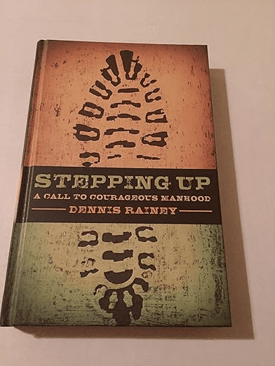 Book titled "Stepping Up: A Call to Courageous Manhood" by Dennis Rainey, featuring a footprint on the cover, is an inspirational choice among the best Bible studies for men.