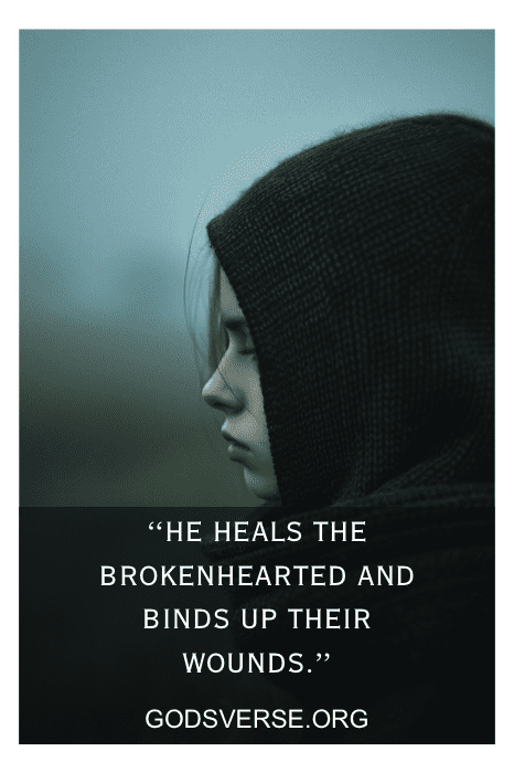Person staring out window - healing after a breakup with Bible verses