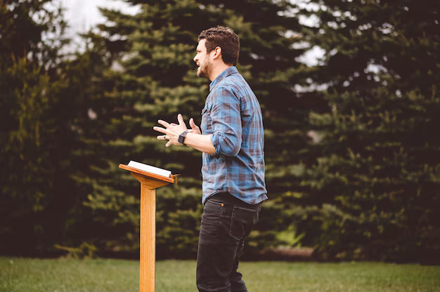 A preacher instructing believers in the Word near a podium