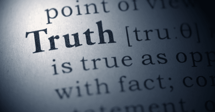 Close-up of the word "Truth" in a dictionary, with surrounding text slightly out of focus.